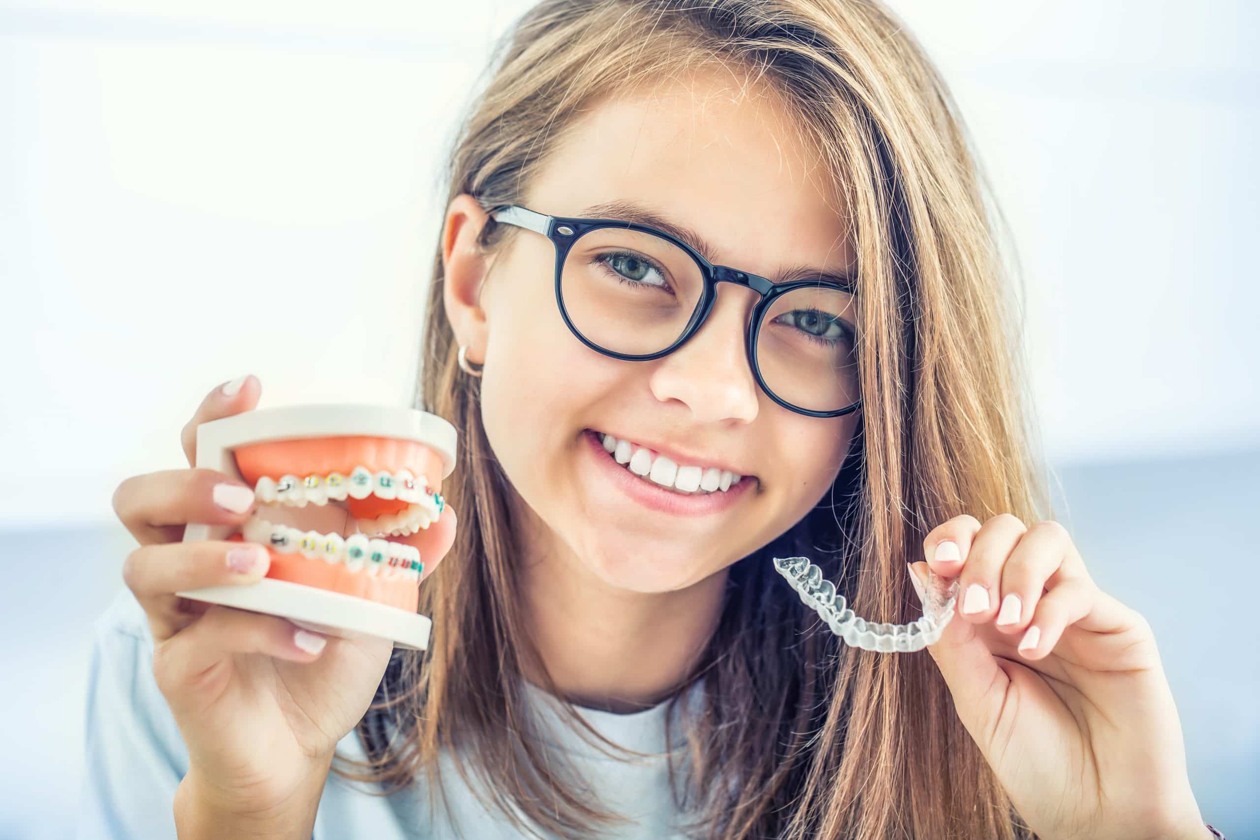 Girl holding invisible braces