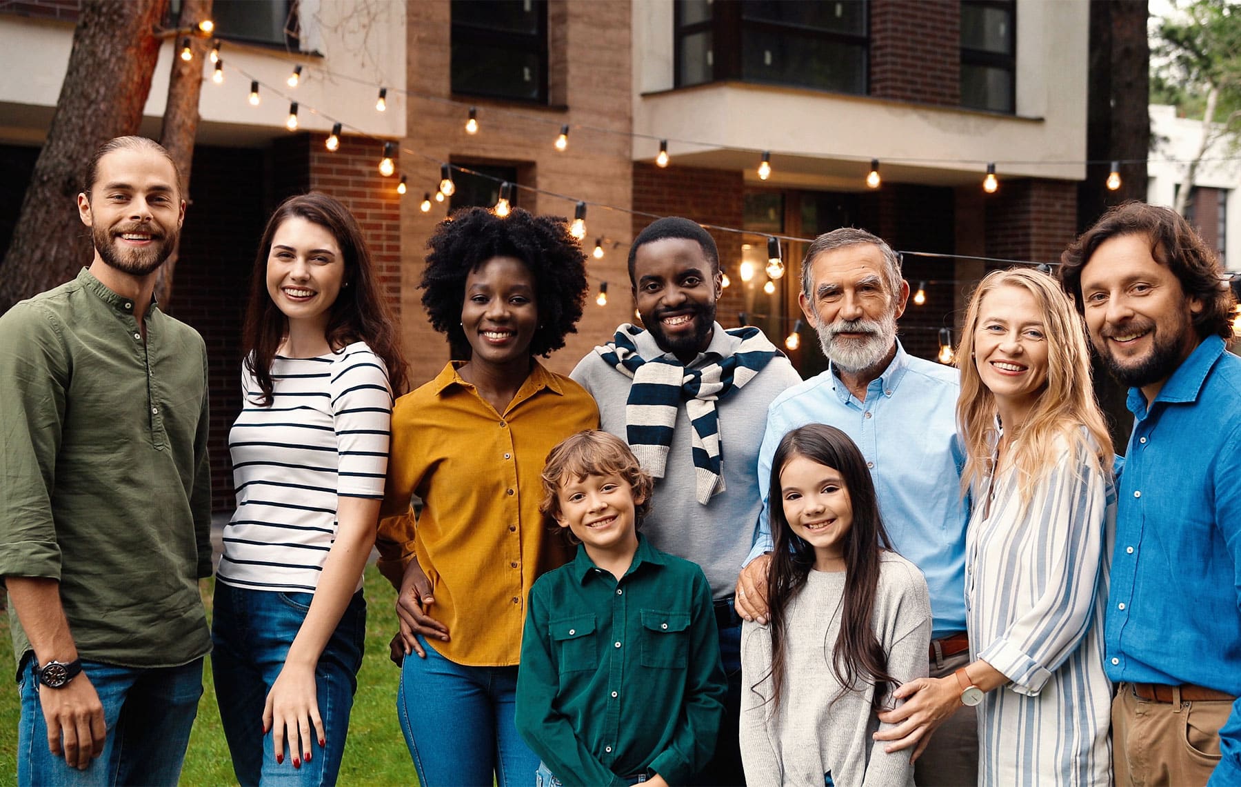 Smiling family and friends outdoors