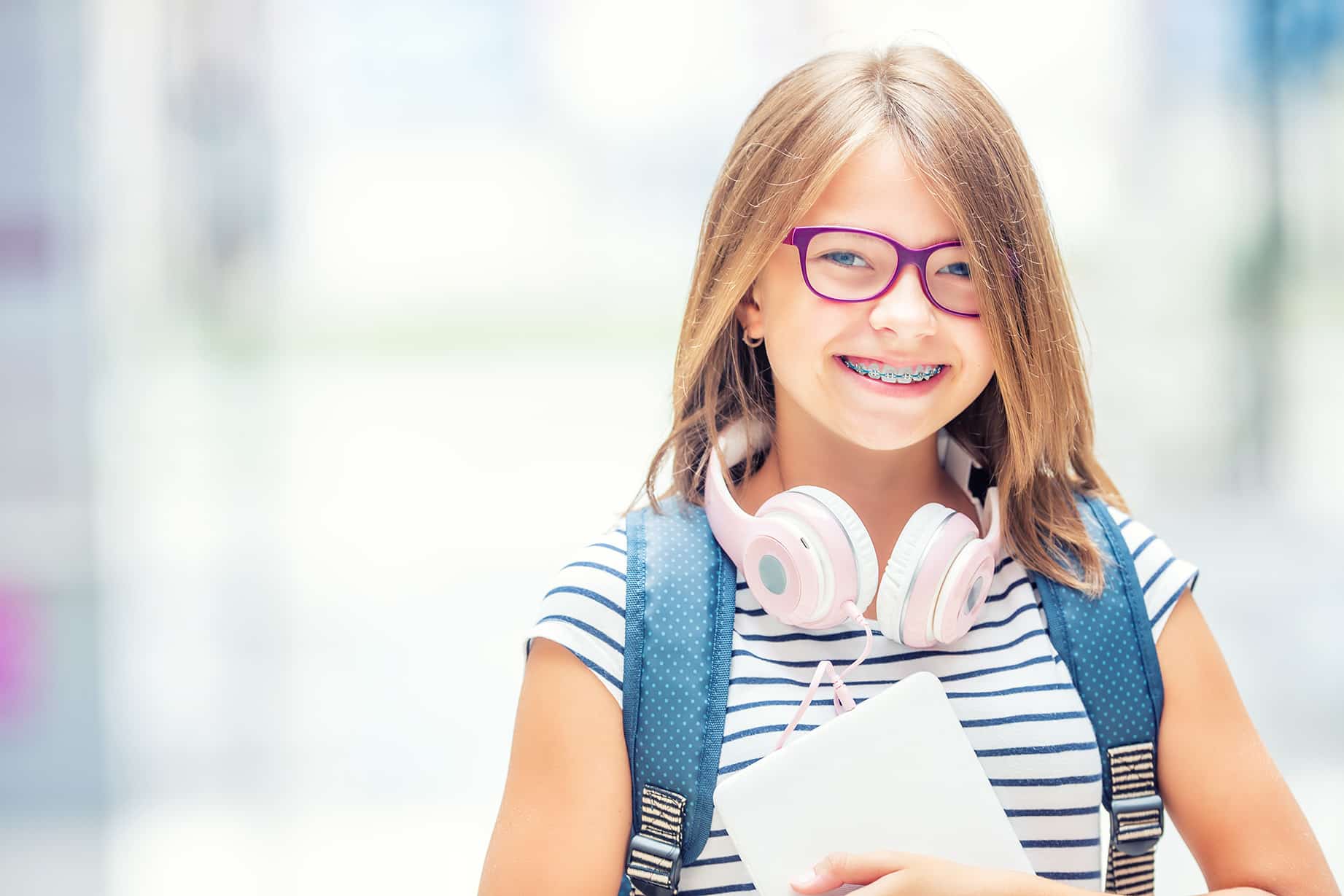 child with metal braces Northeast Orthodontic Specialists in Cincinnati, OH