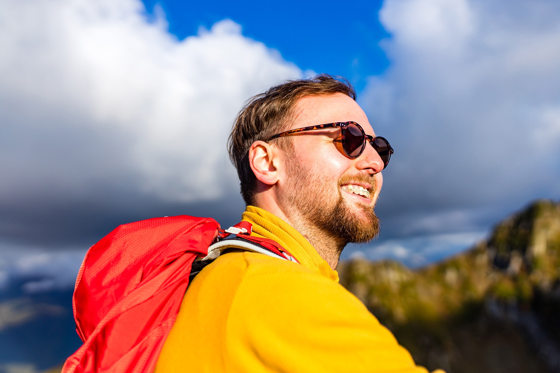 Man smiling with ceramic braces in Loveland, OH