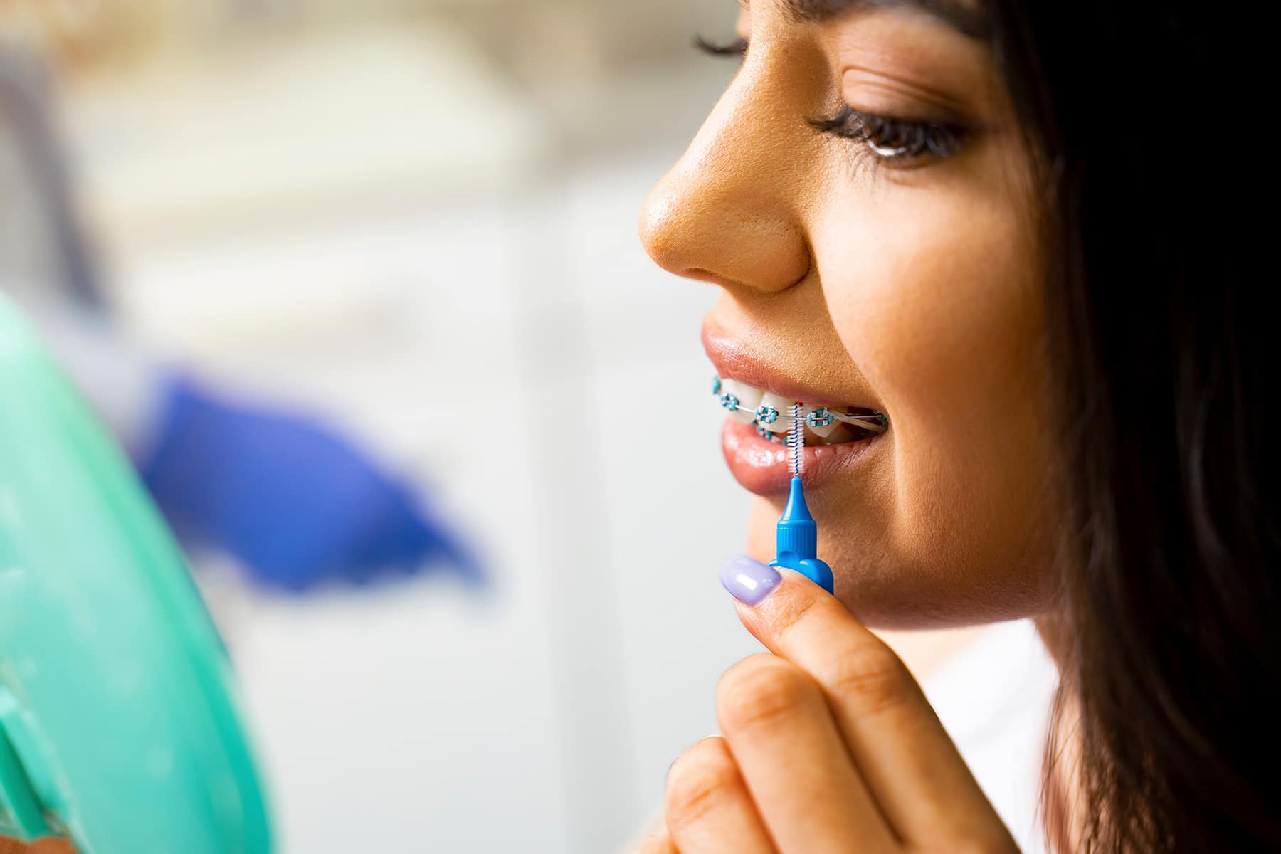 Girl maintaining oral health during orthodontics in Ohio.